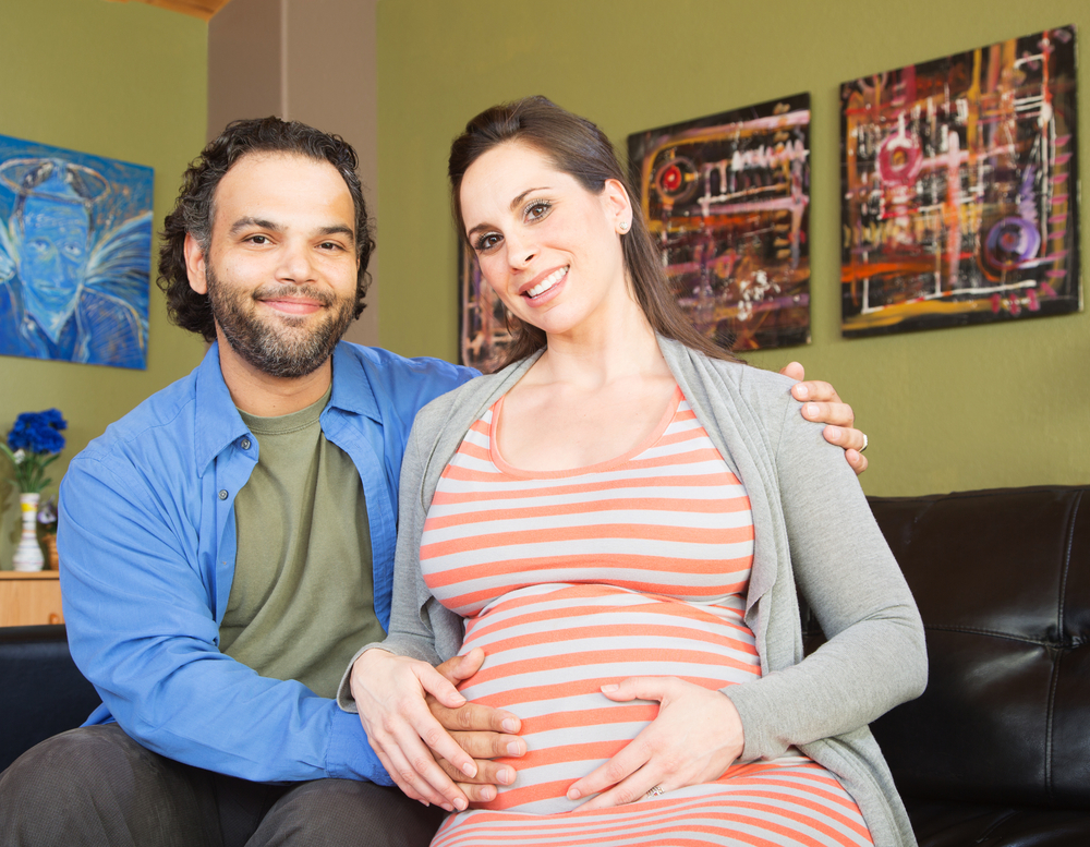 pregnant woman and partner attending an online birth preparation class
